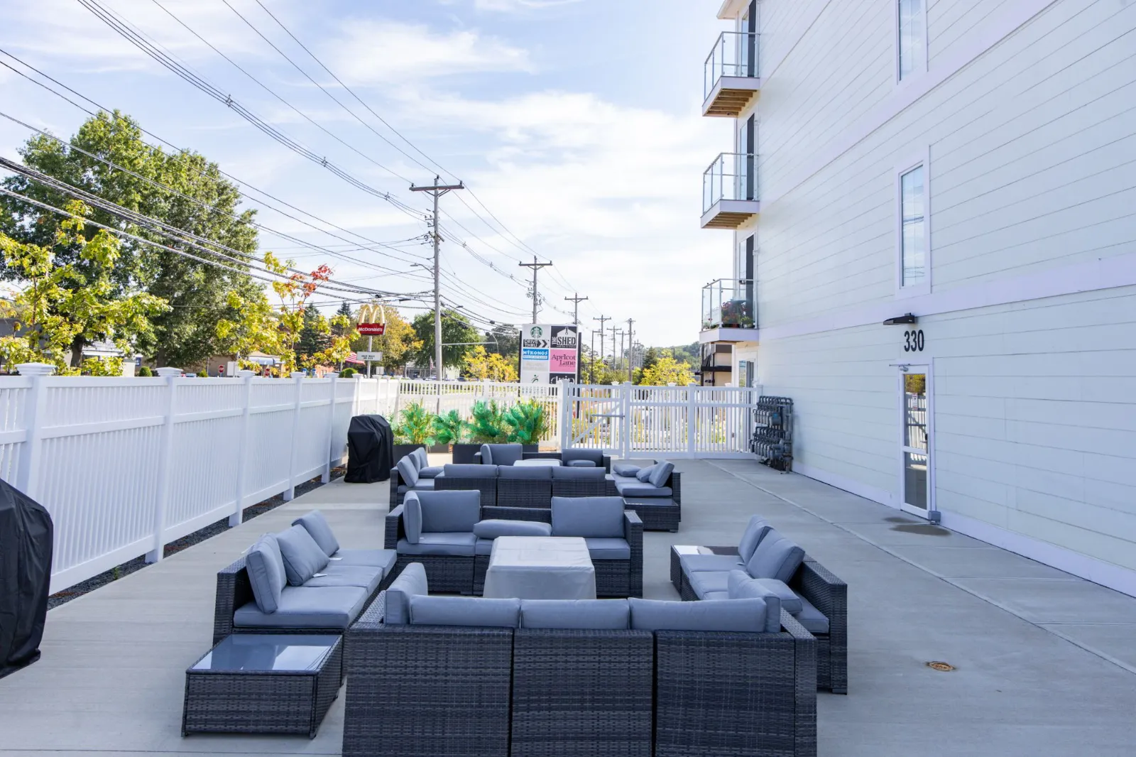 Outdoor lounge seating and grill area on the patio